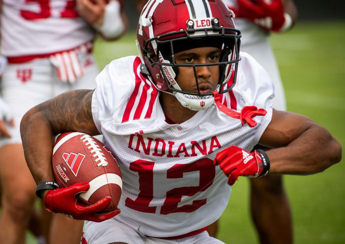 Indiana's Jaylin Lucas (12) runs during a drill during the first day of fall camp for Indiana football at their practice facilities on Wednesday, Aug. 2, 2023.